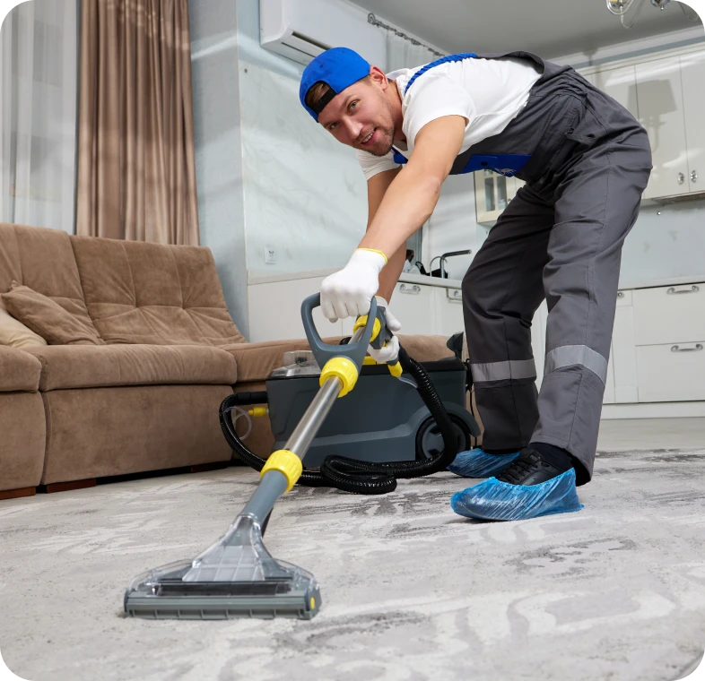 Worker using vacuum on carpet