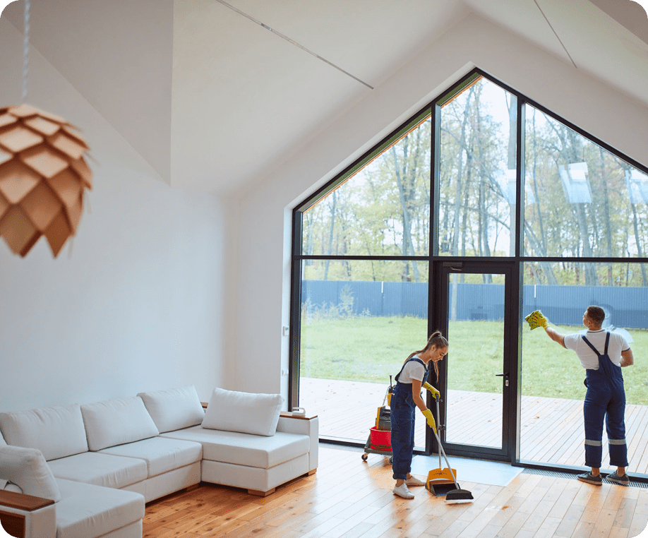 Cleaning team tidying modern living room