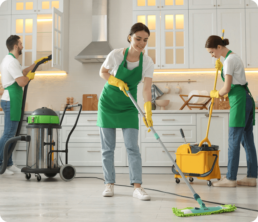 Cleaning crew working in a kitchen